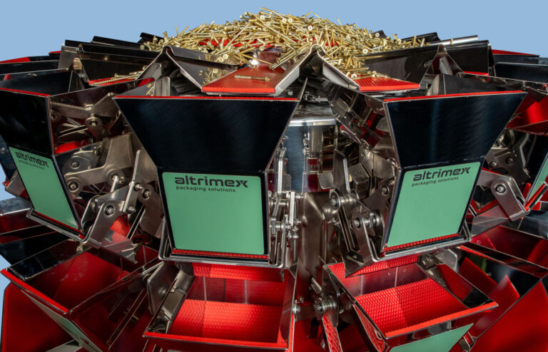 Multihead weigher with golden screws and Altrimex labels on hopper